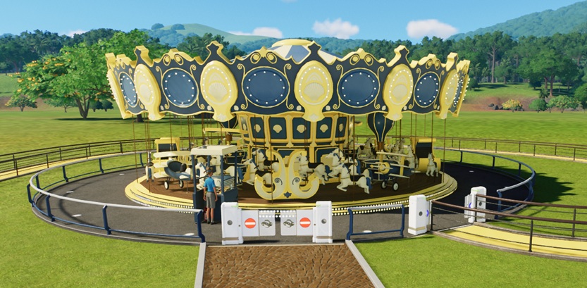 Vooraanzicht van de Grand Carousel, een traditionele Draaimolen met houten paarden, koetsen en diverse andere zitplaatsen in de vorm van wagens, een vliegtuig, een luchtballon, ... De Draaimolen is in gele en blauwe tinten geschilderd.