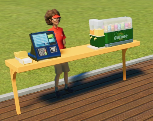 Een lichtgele bank, met betaalterminal en servetten links en een koeltoonbank rechts. De koeltoonbank heeft links twee frisdrankcontainers (één met oranje en één met gele frisdrank). De koeltoonbank bevat vele bontgekleurde blikjes. Op de groene onderkant staat nog eens 'Gulpee'.