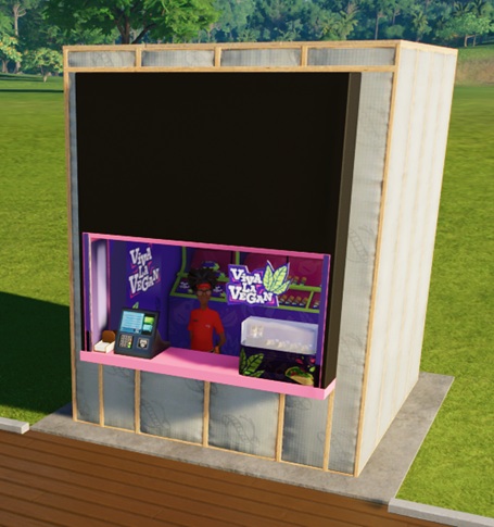 Een Winkeltje met links de betaalterminal en servetten, en rechts een 'thermische bewaardoos' gevuld met Burrito's. Boven de bewaarbox hangt het Viva La Vegan-logo: witte tekst, met rechtsbovenaan drie langwerpige, groene boombladeren. Middenin wacht een Verkoper op Klanten.