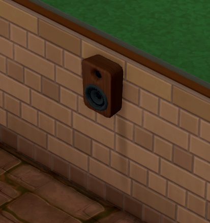 De Ambience Speaker is een saaie, bruine luidspreker aan de muur.