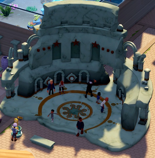 Een enorme ruïne van een rond Oudklassiek theater, met Bezoekers die op en rond het centrum lopen.