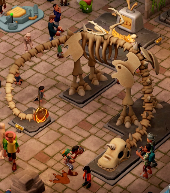 Diverse Bezoekers kijken en wandelen rond een enorm Unihornus-Skelet.