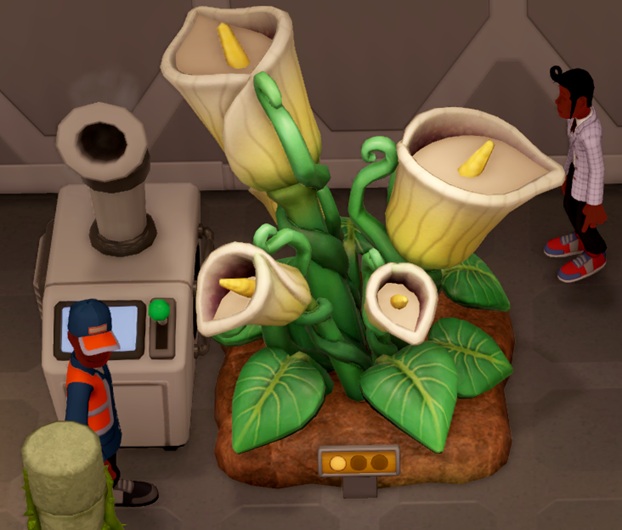 In Two Point Museum is Flagon Fruit een 'bekerplant', bestaande uit vier witte bekers met in elke beker een gele stamper. Links zijn een Conciërge en een Luchtbevochtiger zichtbaar. Rechts kijkt een Bezoeker toe.