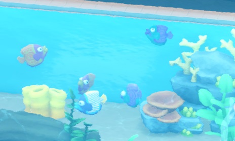 Vijf Flambuoyant Fishes, met veelkleurige lichamen, zwemmen in hun Aquarium.