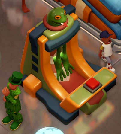 Een installatie met bovenaan in het midden een kunstmatig Frogborne-hoofd. Twee 'Kikkerbenen' hangen middenin de machine. Een grote, rode knop staat vooraan op de automaat.