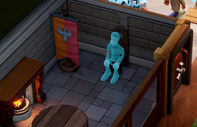 Een Peasant-Spook zit op een houten stoel in zijn Polterguest Room. Links staan een vaandel en een open haard; onderaan is een deel van een houten tafel te zien.
