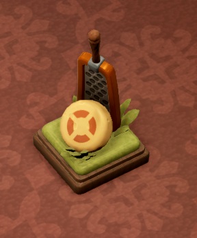 Een kaasrasp met een ronde kaas erbij. De kaas draagt ronde markeringen en imiteert zo een sportbal of hockeypuck.
